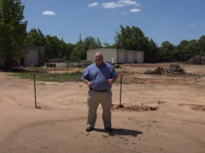 Surplus Buildings at Junk Yard Sold on Hwy. 14; City/County To Split Proceeds